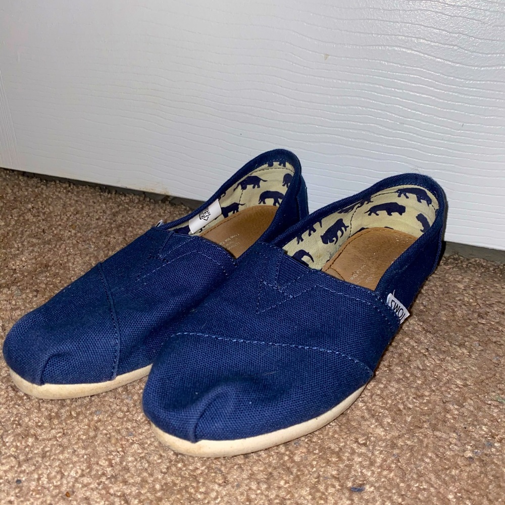Tom’s navy slip ons